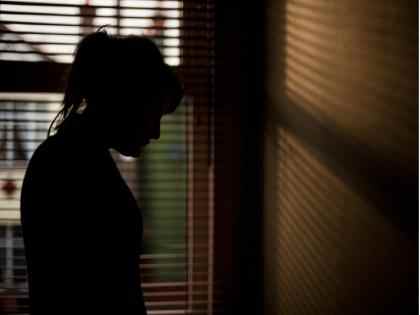 Young woman herding goats abused in a field