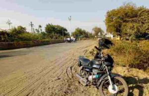 Pathardi two-wheeler stuck to the power lines on the highway