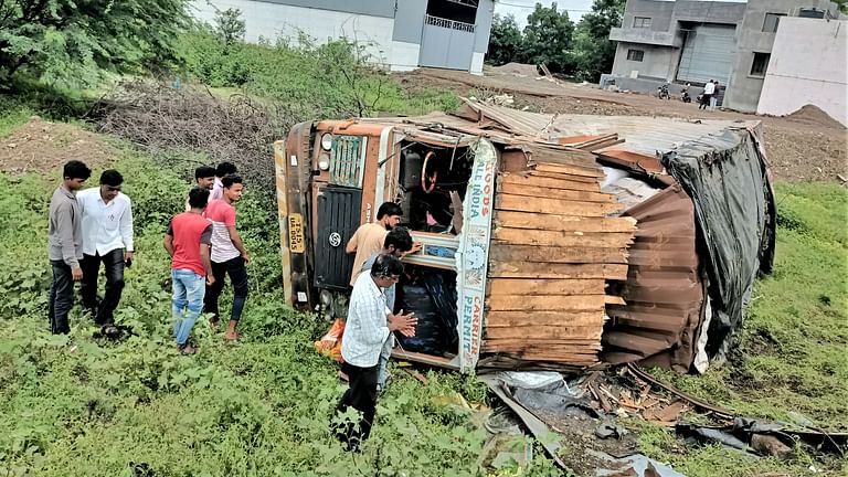 Sangamner Accident the cargo container overturned under the bridge